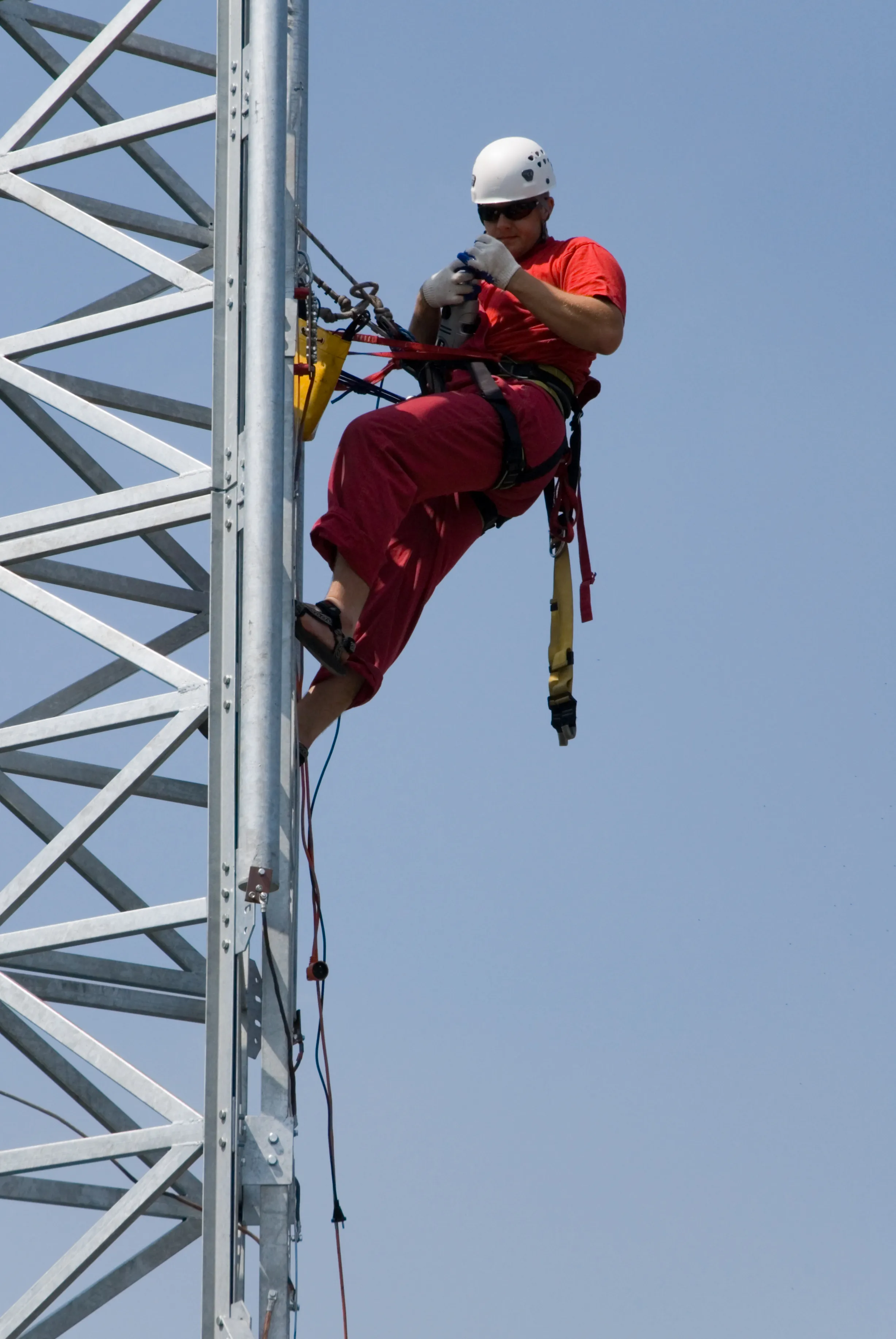 Tower engineer climbing a lattice tower